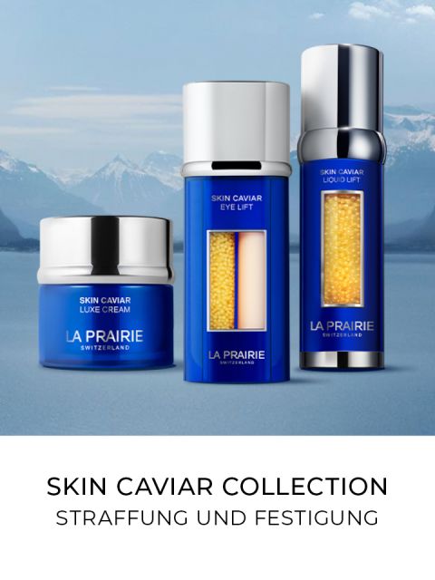 Tres frascos azules de cuidado de la piel de la colección Skin Caviar de La Prairie se presentan con un fondo de montaña. El texto dice: "Colección Skin Caviar Reafirmante y Tensor".