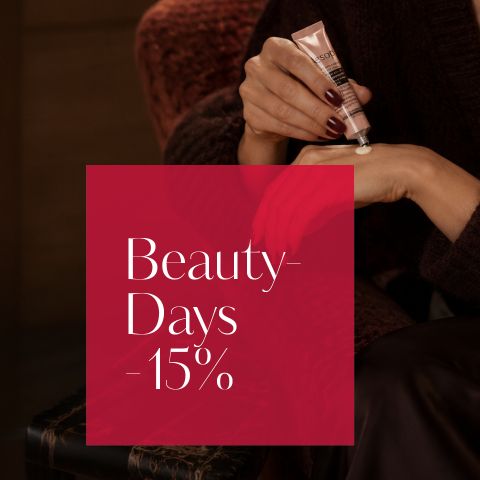 Una persona se está aplicando crema en la mano, junto a ella hay una caja roja con la inscripción: "Beauty-Sale - 15 %".