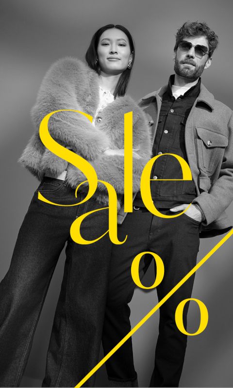 Una mujer elegante y un hombre con atuendos modernos posan con confianza con la palabra "Sale" y un signo de porcentaje en amarillo llamativo sobre la imagen.