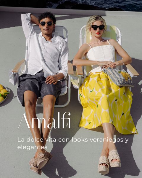 Un hombre y una mujer con ropa de verano se relajan en tumbonas al aire libre, junto a ellos hay limones. El texto dice: "Amalfi. La dolce vita con looks veraniegos y elegantes."