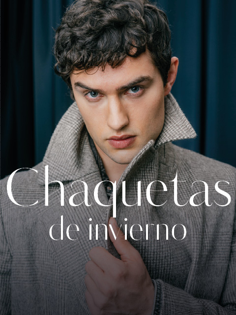 Un hombre con un abrigo gris estampado en el que se lee «Chaquetas de invierno».