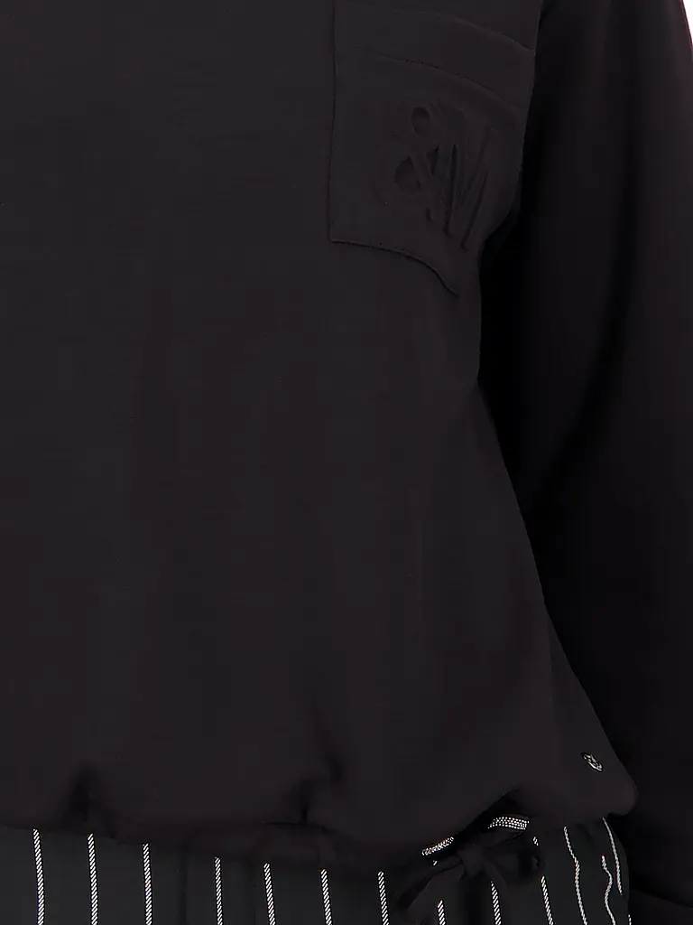 MONARI | Pullover
Produktname: Jersey
Marke: MONARI
Farbe: negro
Categorías: Moda, Mujer

Largo de la manga: Manga larga
Material: Punto, Modal, Poliéster / Poliamida, Elástico
Forma del cuello: Cuello alto
Estampado: Liso
Corte (Prenda superior): Suelto
Detall | 