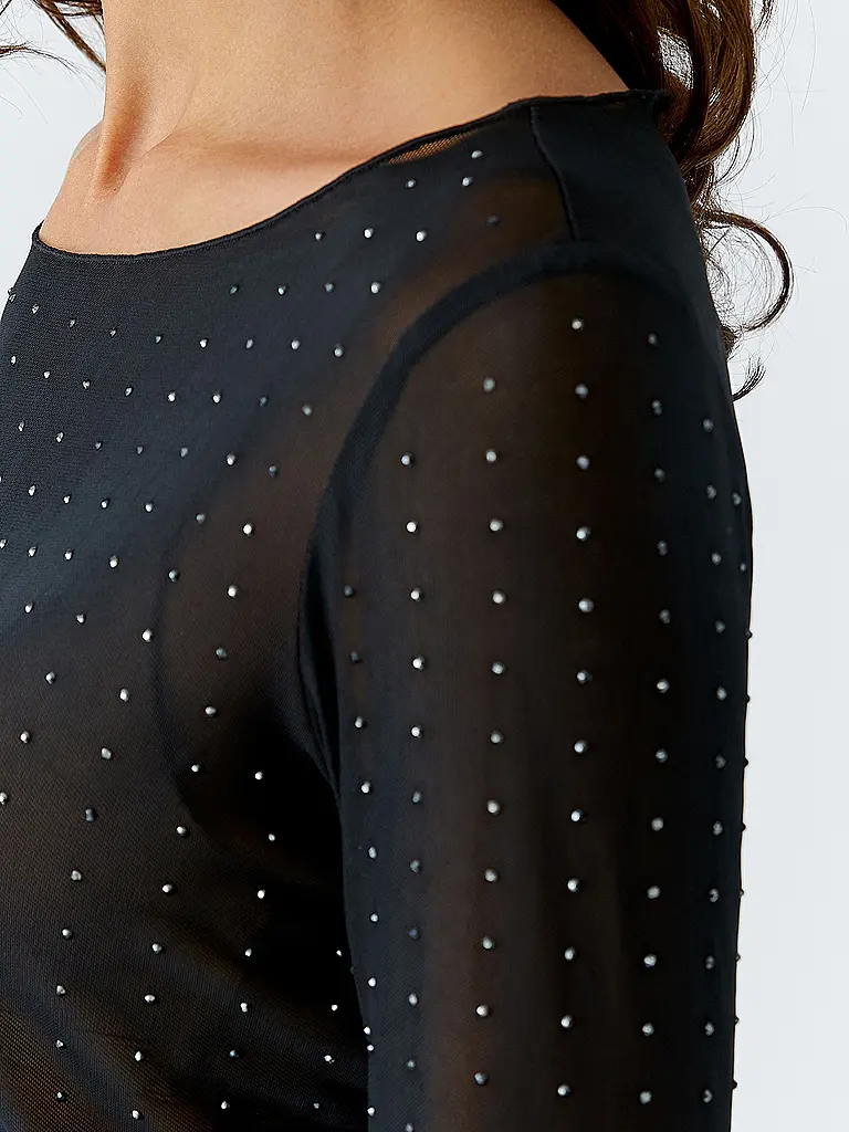 OUÍ | Nombre del producto: Camiseta de manga larga
Marca: OUÍ
Color: negro
Categorías: Moda, Mujer

Largo de manga: Manga larga
Escote: Cuello barco
Material: Jersey, Poliéster / Poliamida, Elástico
Diseño: Liso
Corte (Prenda superior): Slim
Detalles: Estr | Negro