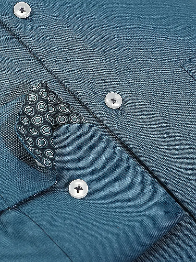 SEIDENSTICKER | Camisa de vestir
Marca: SEIDENSTICKER
Color: petróleo
Categorías: Moda, Hombre

Largo de manga: Manga larga
Material: Algodón
Forma del cuello: Cuello Kent
Diseño: Liso
Corte (Prenda superior): Regular
Detalles: Bolsillos insertados | Petróleo