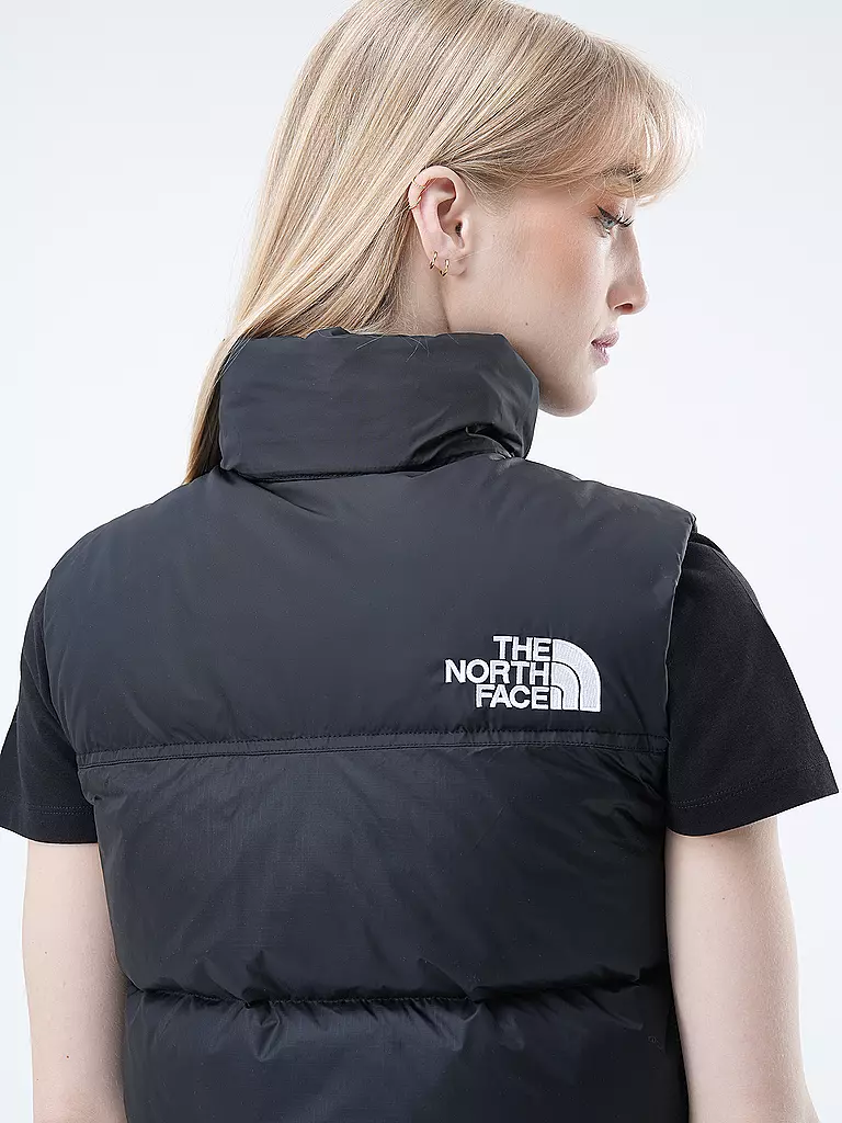 THE NORTH FACE | Chaleco acolchado de plumón
Marca: THE NORTH FACE
Color: negro
Categorías: Moda, Mujer

Largo de manga: Sin mangas
Material: Plumón, Nylon
Forma del cuello: Cuello alto, Capucha
Diseño: Liso, Logo, Estampado
Corte (Prenda exterior): Regular
Estilo: Mo | 