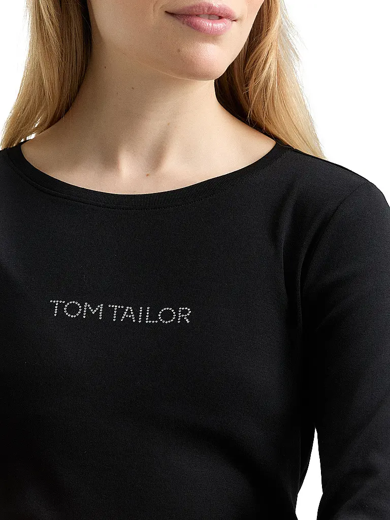 TOM TAILOR | Camiseta
Marca: TOM TAILOR
Color: negro
Categorías: Moda, Mujer

Largo de manga: Manga 3/4
Cuello: Cuello redondo
Material: Jersey, Algodón, Elástico
Diseño: Liso
Corte (Prenda superior): Slim
Detalles: Logo, Estrás | Negro